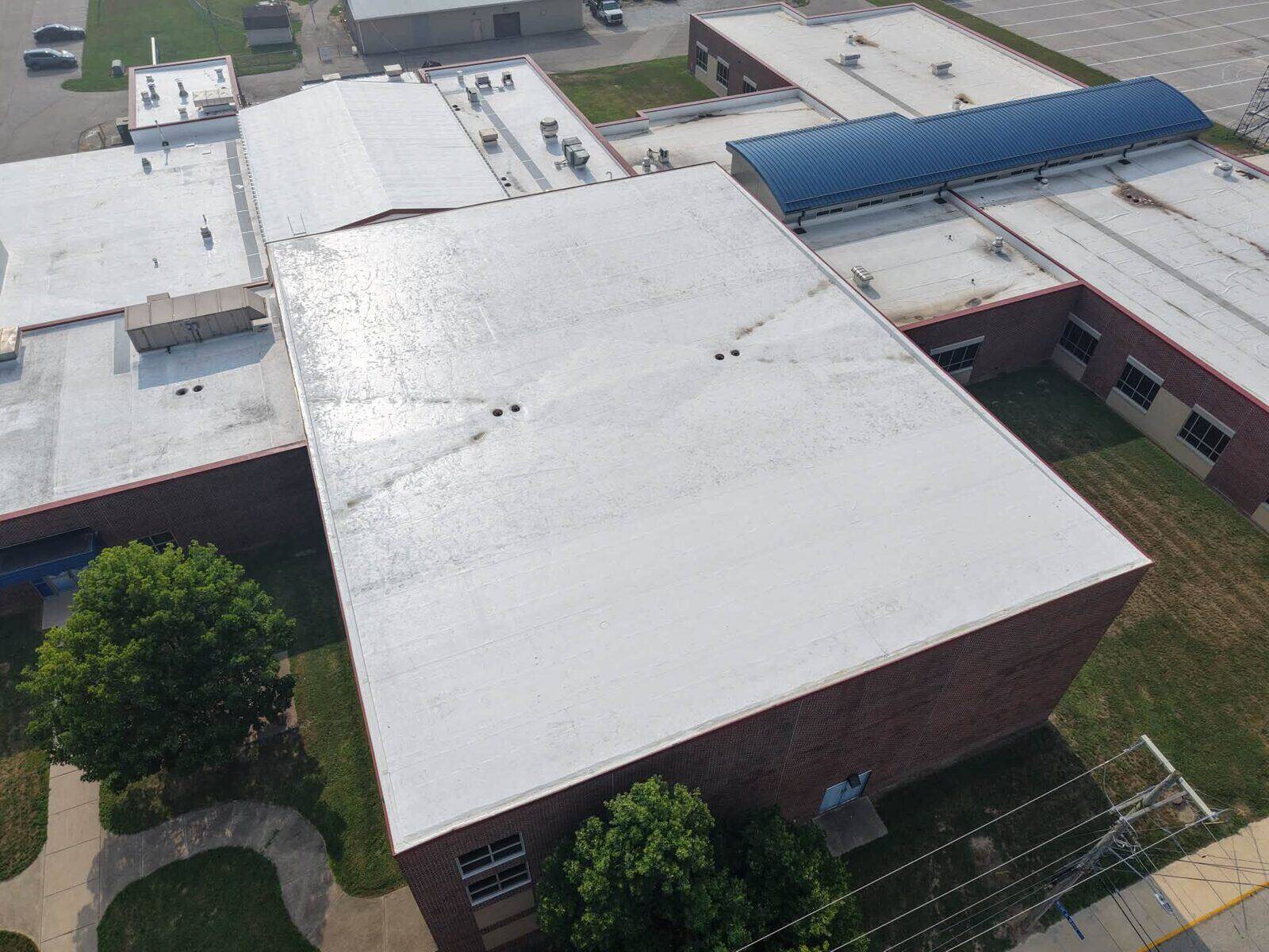 A large white low-slope membrane roof.